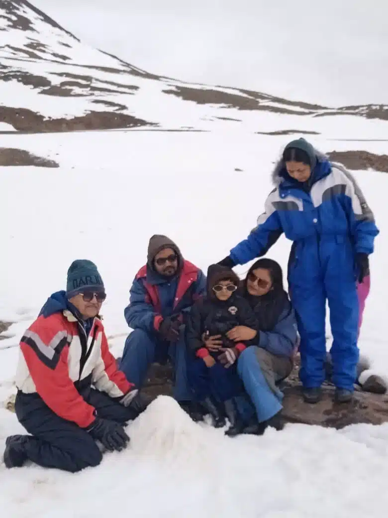 Suzu Travels guests in winter gear in Manali