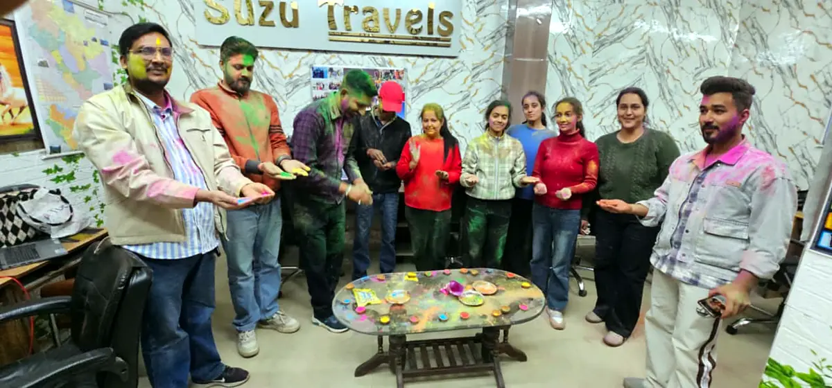 The Suzu Travels team celebrating Holi at the office
