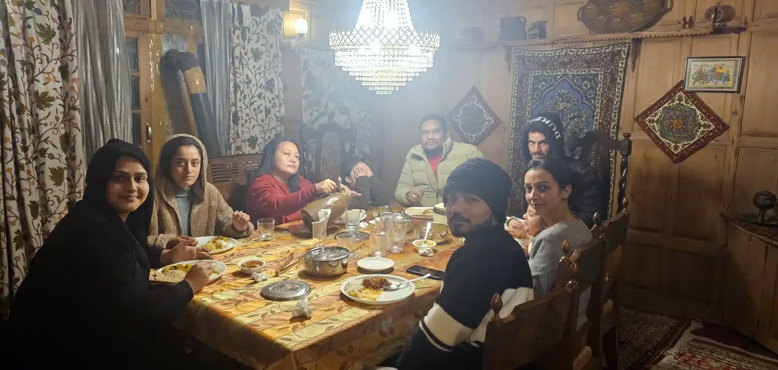 Guests having dinner on a Srinagar houseboat