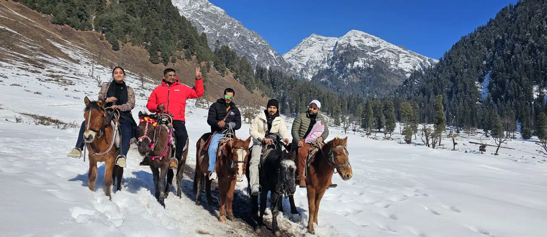 pahalgam pony ride snow kashmir Guests on a pony ride through snow in Pahalgam on a Kashmir tour package