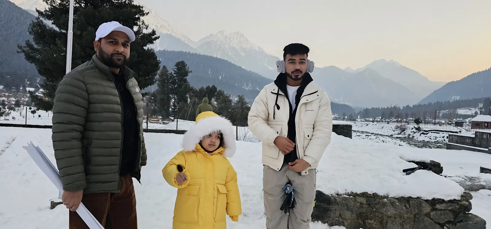 Family on a Suzu Travels tour in the snowy Pahalgam valley
