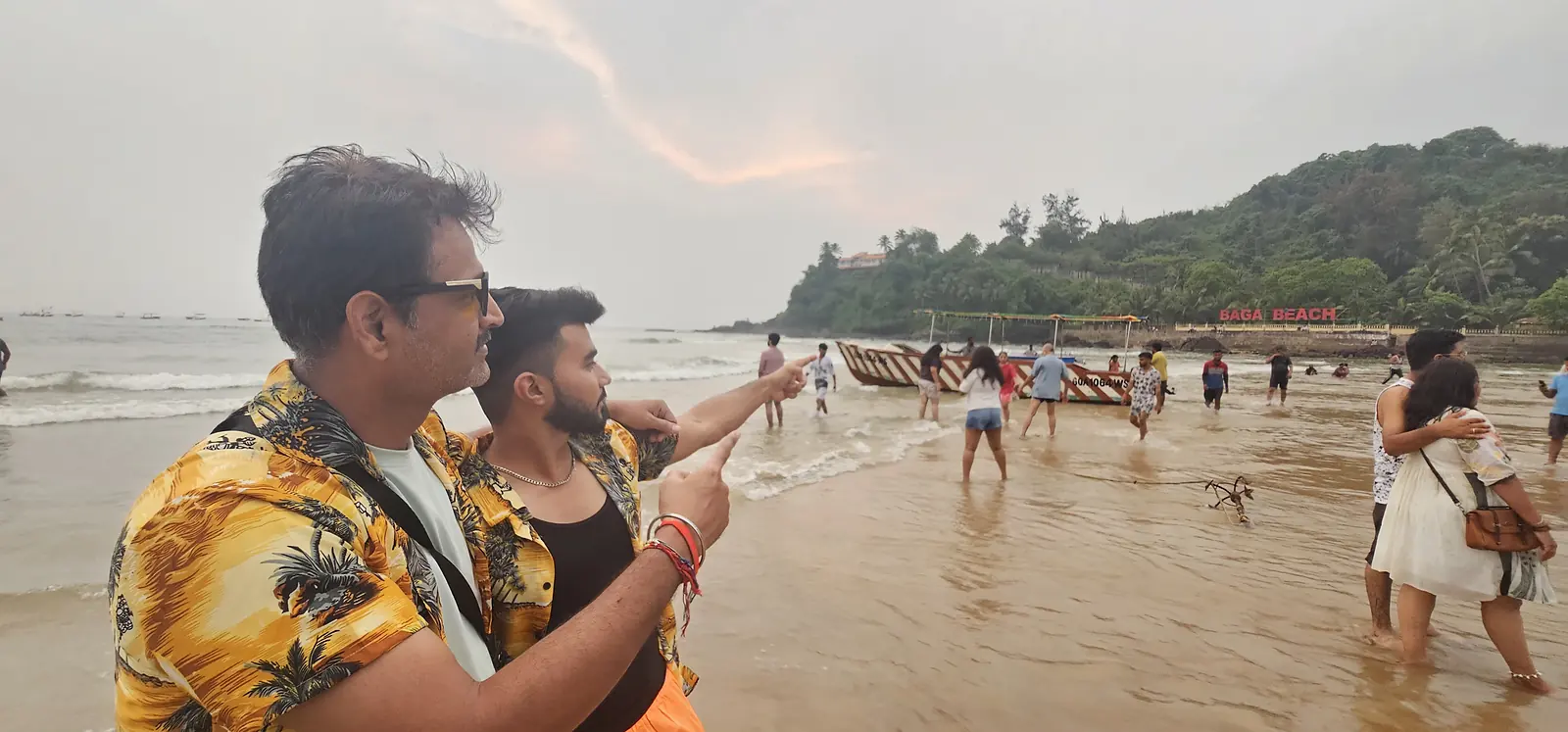 Lively Goa beach with tourists in the evening