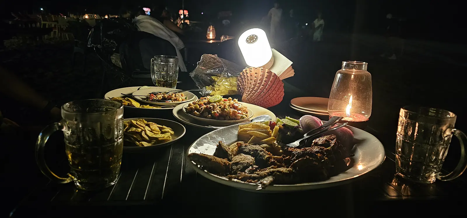 Candlelight dinner at a Goa beach shack at night