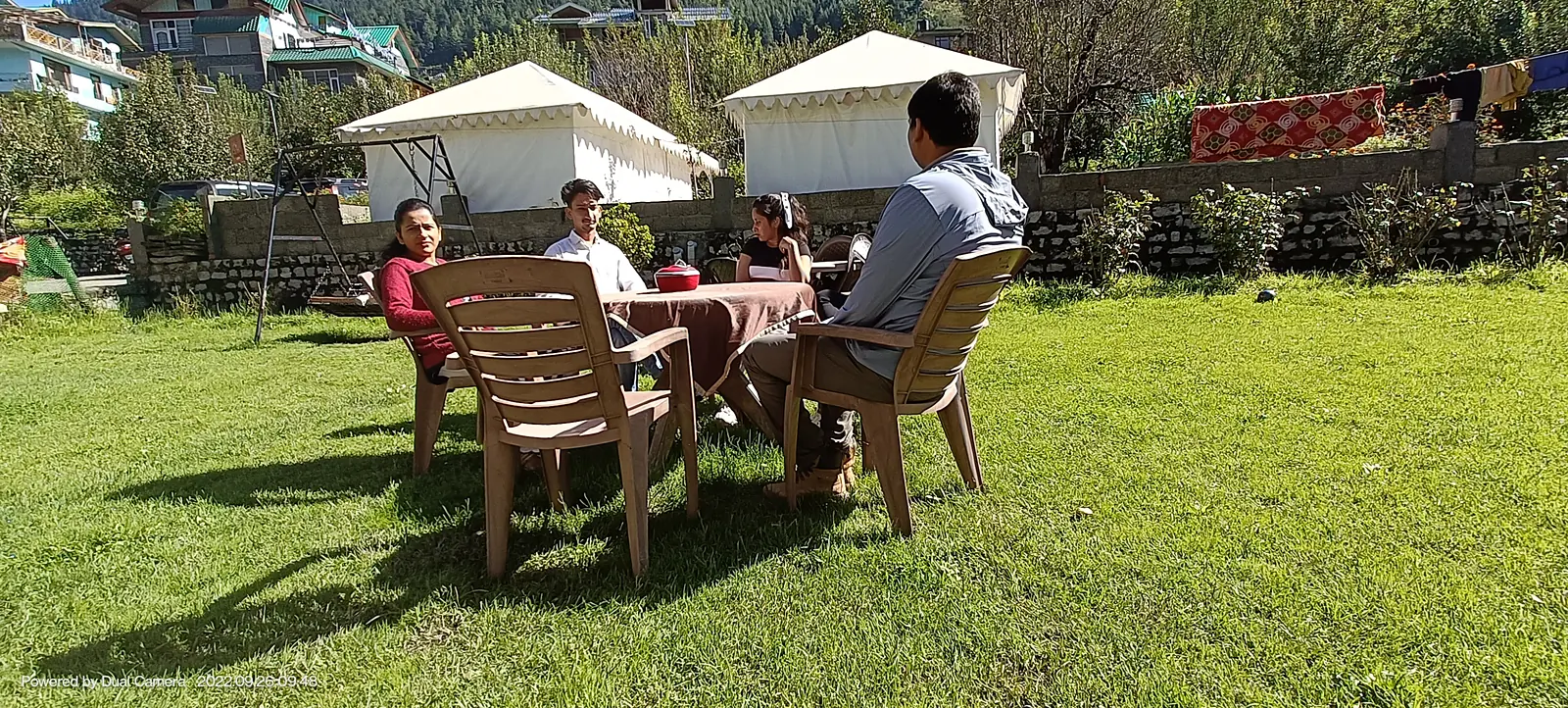 Resort lawn with tents and chairs in Manali