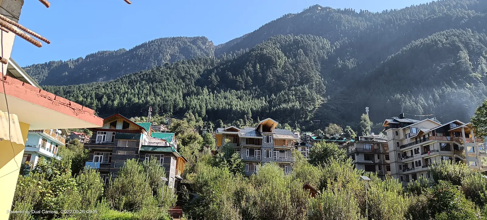 Manali town with forested mountains