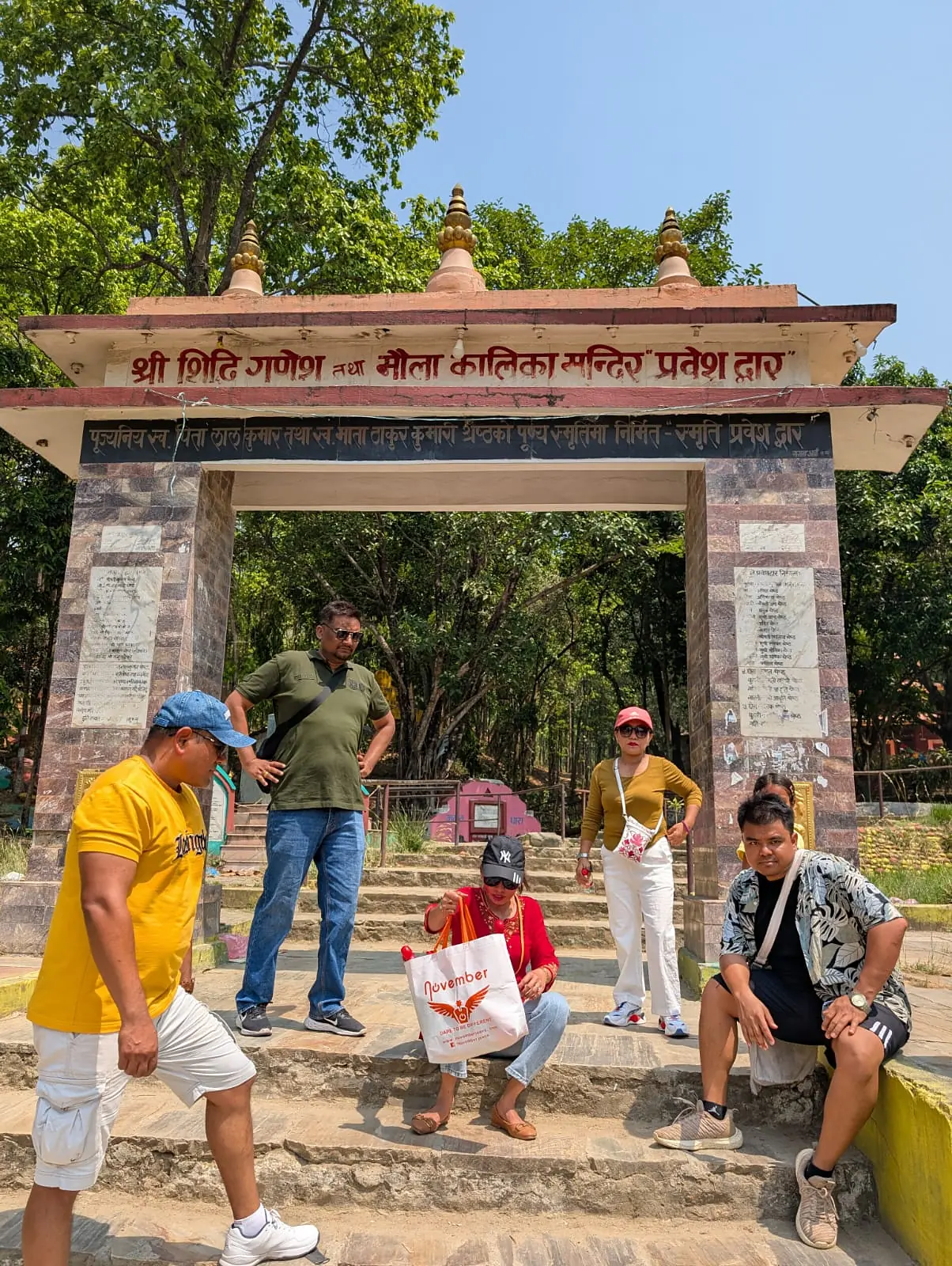 nepal tour group temple gate Suzu Travels Nepal tour group at a temple gate