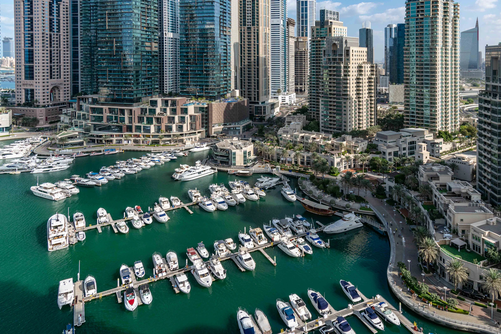 suzu abroad dubai marina yachts Yachts moored in Dubai Marina between high-rise towers
