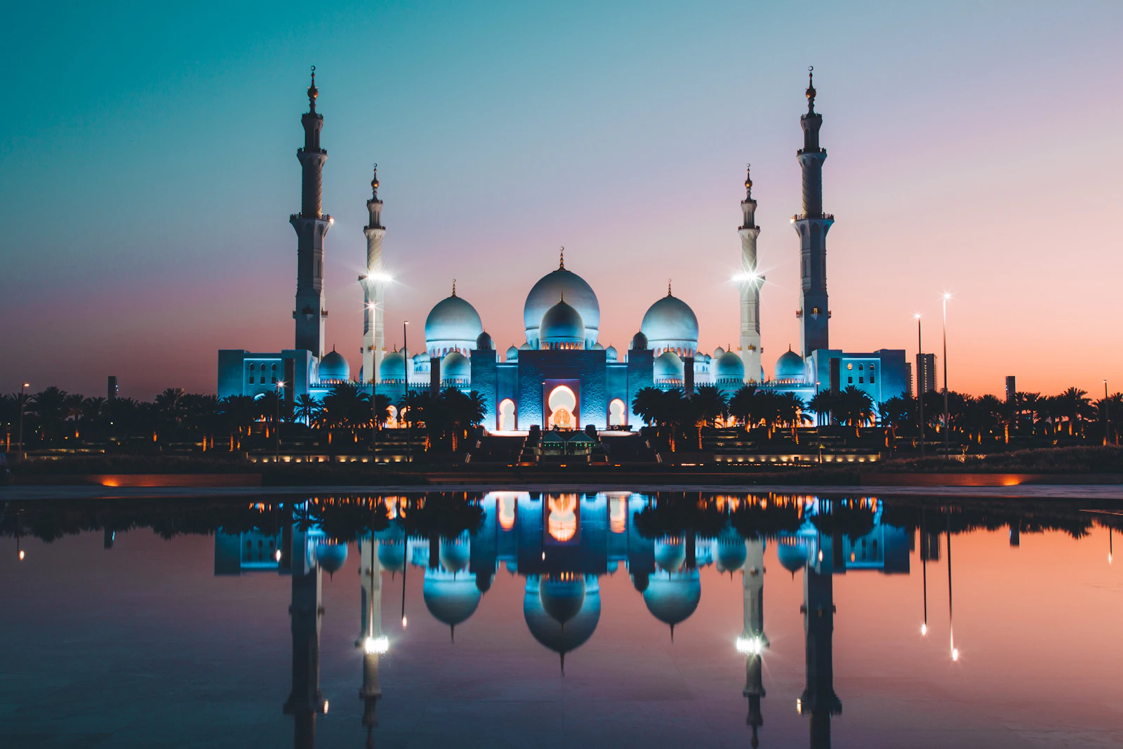 suzu abroad dubai sheikh zayed grand mosque Sheikh Zayed Grand Mosque lit up at dusk and reflected in its pool, Abu Dhabi