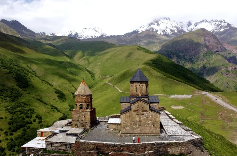 suzu abroad georgia Gergeti Trinity Church below the Caucasus mountains, Kazbegi, Georgia