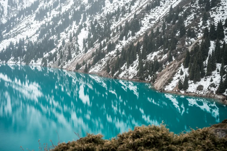 suzu abroad kazakhstan Big Almaty Lake below snowy mountains, Kazakhstan