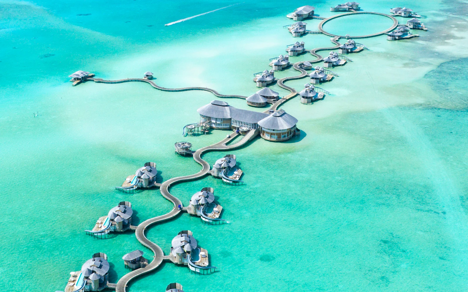 suzu abroad maldives 1 Overwater villas in a turquoise atoll, Maldives, from the air