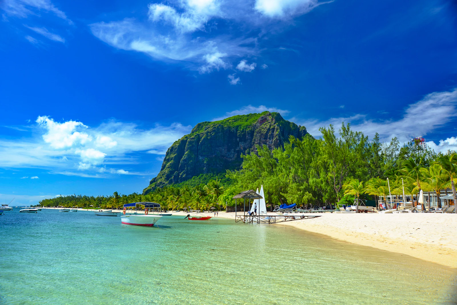 suzu abroad mauritius le morne beach boats Boats in a turquoise lagoon off a white-sand beach below Le Morne Brabant, Mauritius