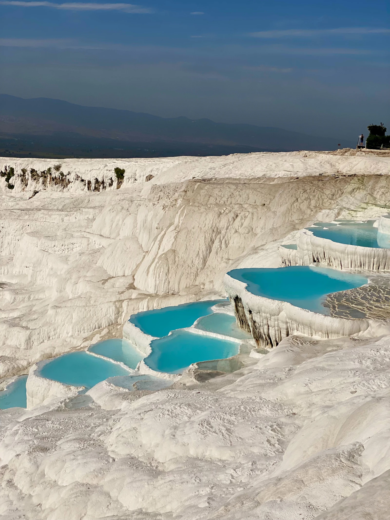 suzu abroad turkey pamukkale cotton castle White travertine terraces and blue pools of Pamukkale, the "Cotton Castle", Turkey