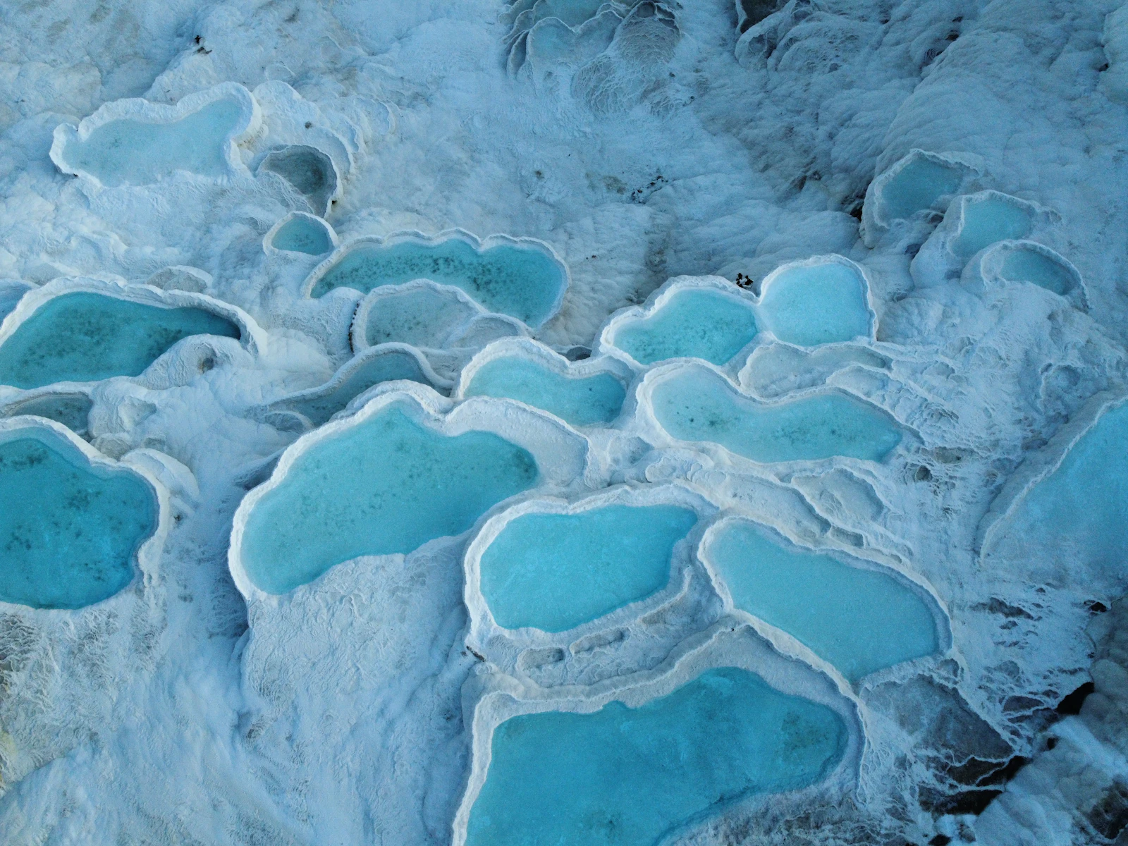 suzu abroad turkey pamukkale travertine pools Aerial view of the turquoise travertine pools of Pamukkale, Denizli, Turkey