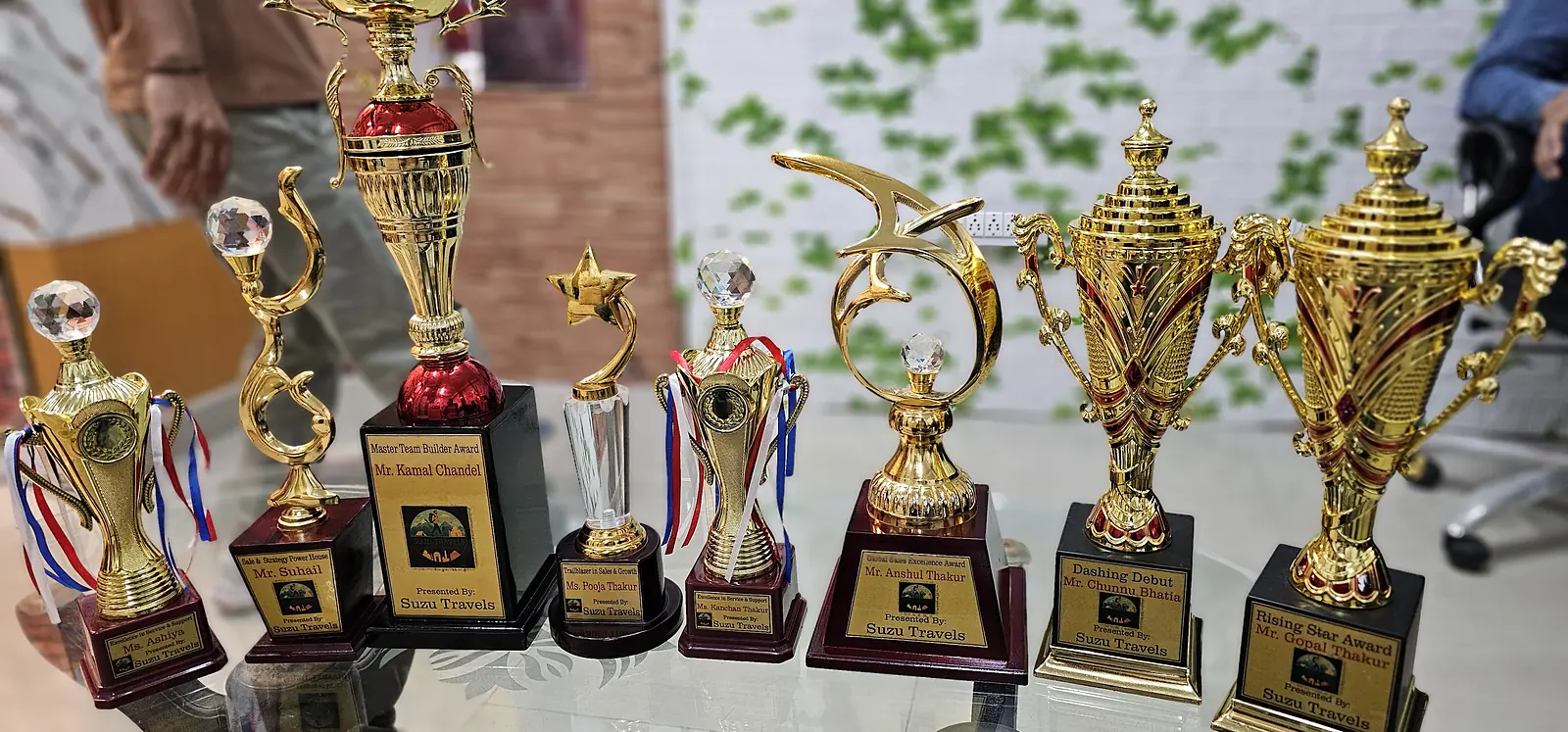suzu travels trophy collection Collection of trophies at Suzu Travels
