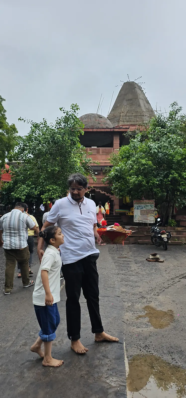 ujjain temple shikhara pilgrims Pilgrims walking to a temple shikhara in Ujjain